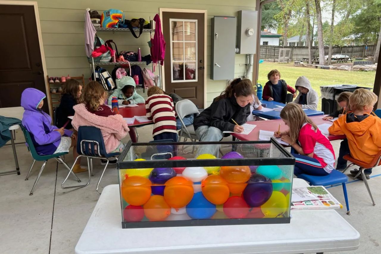 Preschool students learning together in a Montessori classroom