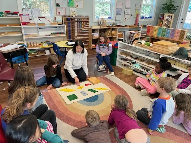 Class group lesson with Montessori materials